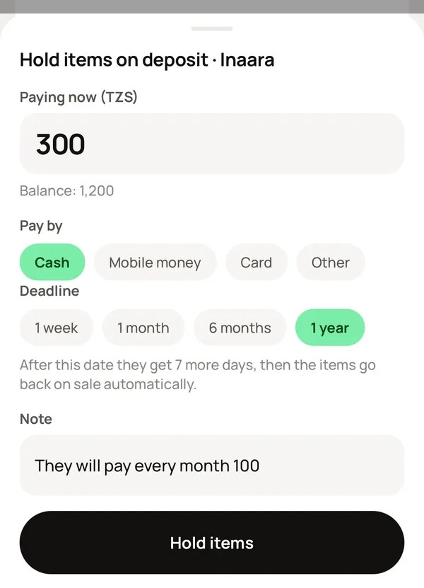 The deposit sheet: the amount paid now, the balance, the deadline, and Hold items.
