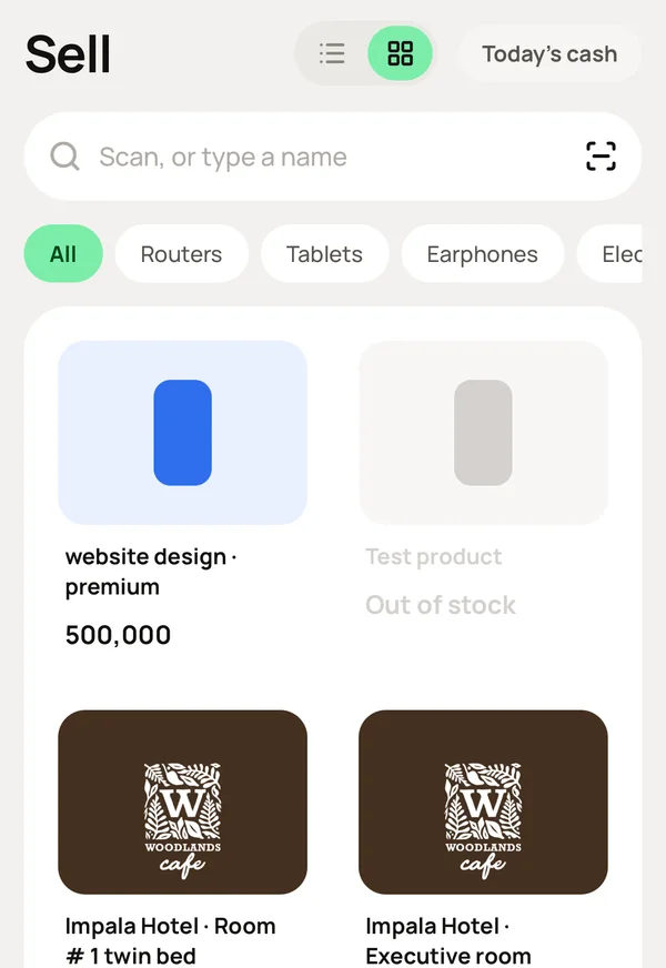The Sell screen: search or scan, category chips, and the product grid.